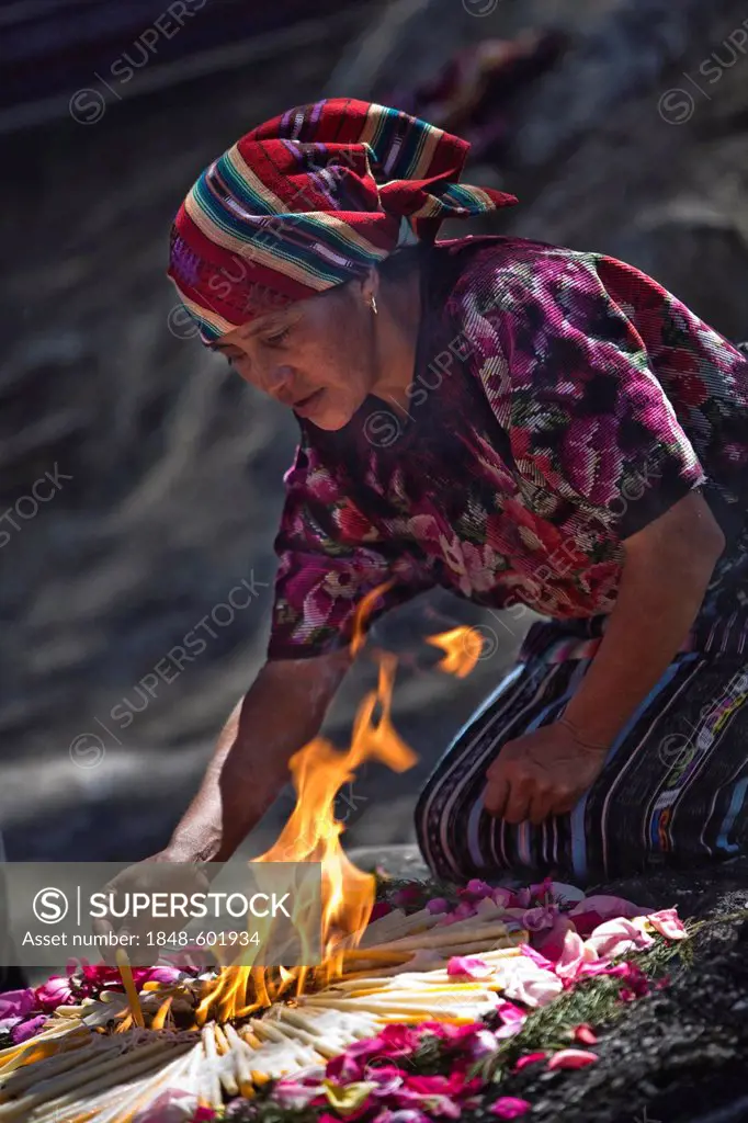 Quiche native woman honouring dead at the cemetery, Chichicastenango, Quiche Department, Guatemala, Central America