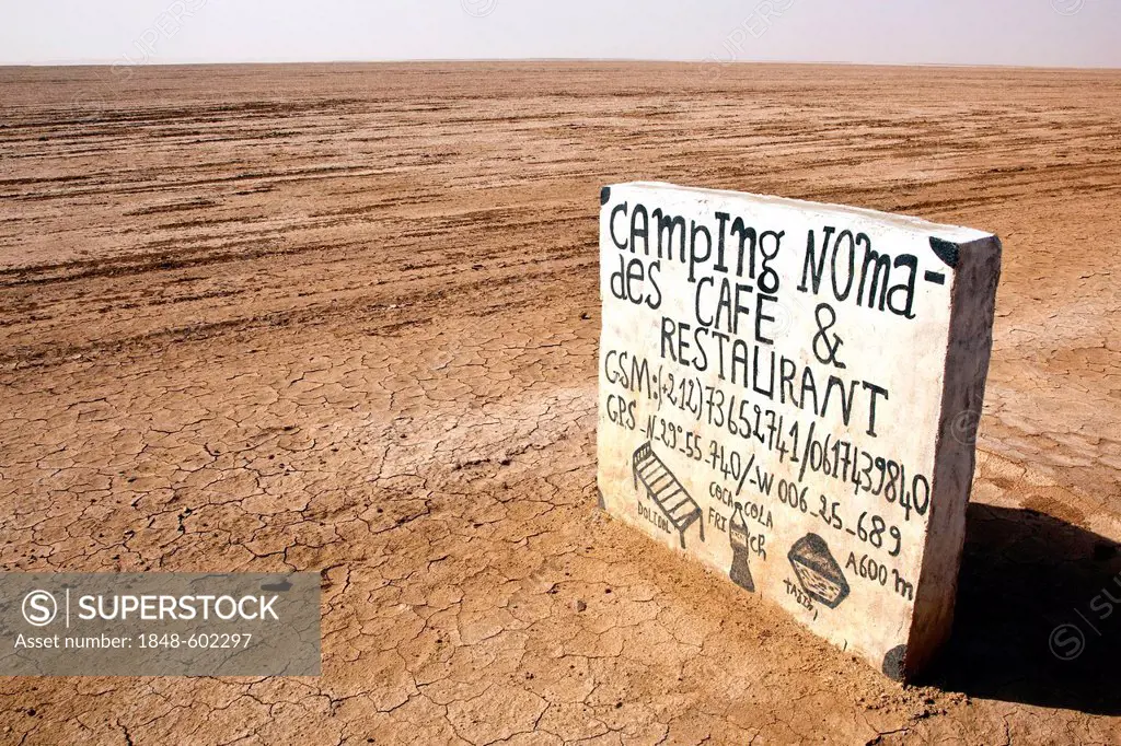 Sign for a camp site at the beginning of the Sahara Desert near Mhamid, Morocco, Africa