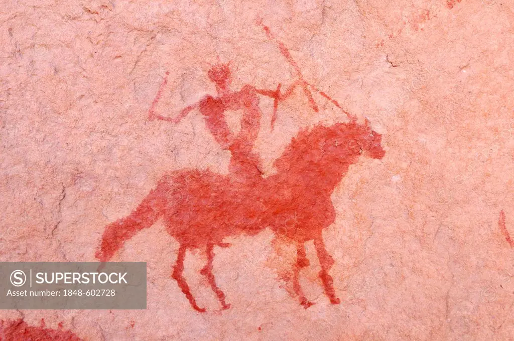 Painted rider on a horse, neolithic rockart of the Acacus Mountains or Tadrart Acacus range, Tassili n'Ajjer National Park, Unesco World Heritage Site...