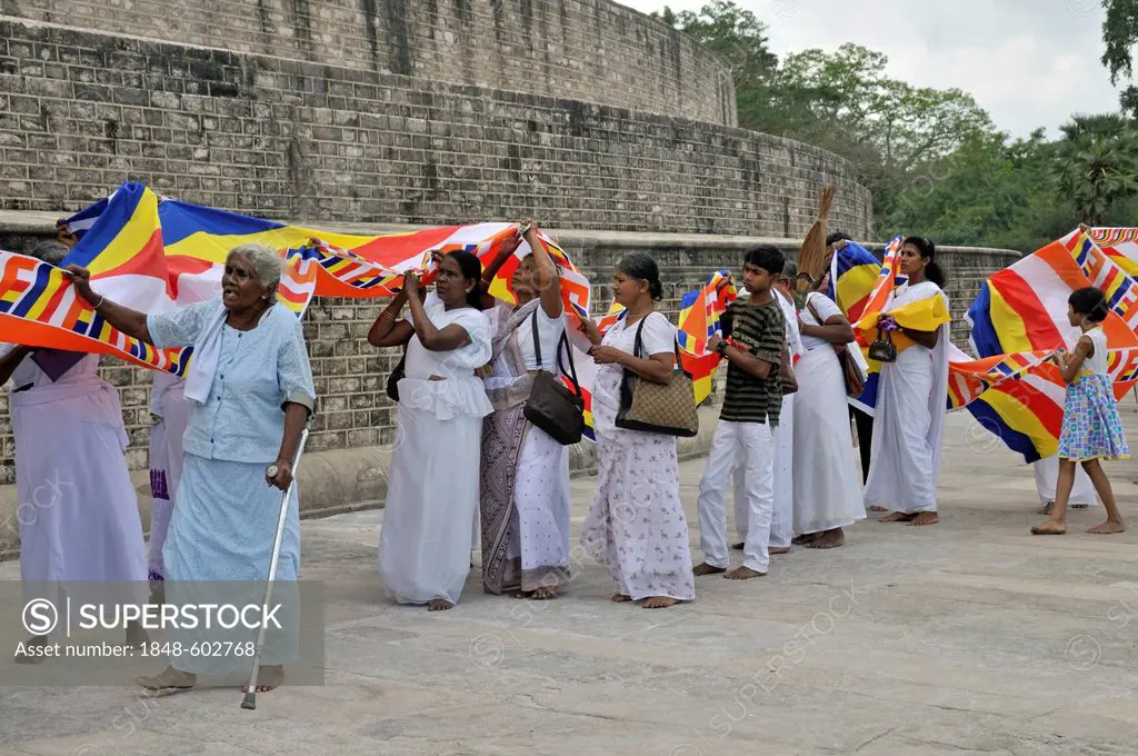 Puja, long cloth, 300 metres, Buddhist flag is draped around the Ruvanveli Seya Dagoba or Ruwanweliseya Dagoba, Anuradhapura, Unesco World Heritage Si...