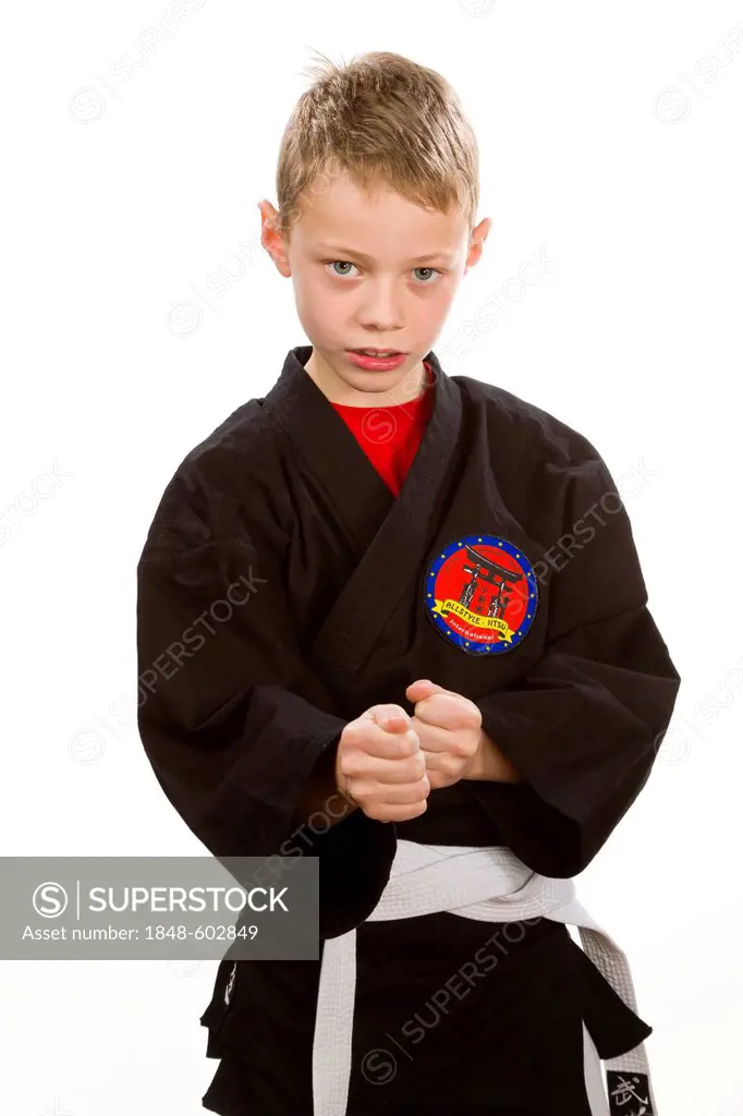 A boy, 9 years, wearing martial arts suit