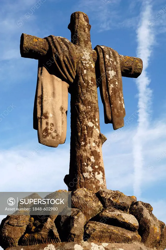 Cloth draping a stone cross, 19th Century, against a blue sky in the cemetery of Guebwiller, Route de Colmar, Guebwiller, Alsace, France, Europe