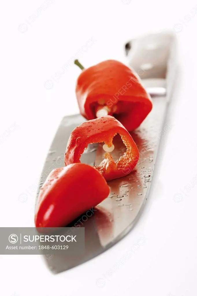 Peperoni (Capsicum) on a knife's edge