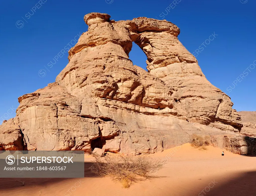 Arch or natural window in the rock formation of La Cathedrale, Acacus Mountains or Tadrart Acacus range, Tassili n'Ajjer National Park, Unesco World H...