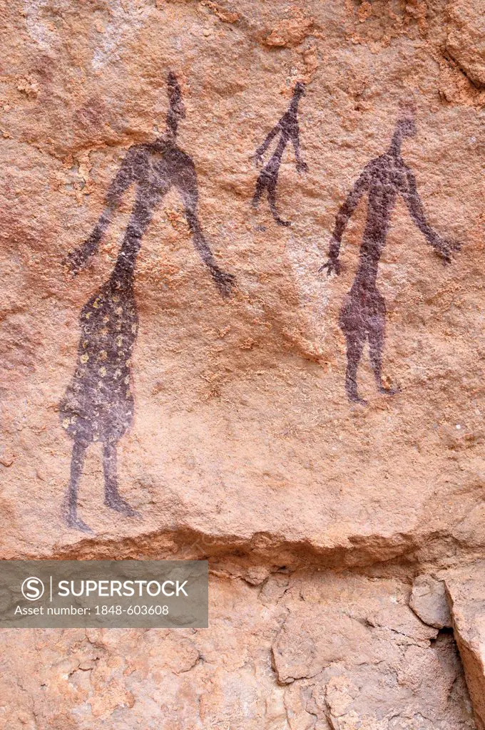 Painted group of people, neolithic rock art at Tin Meskis, Adrar N'Ahnet, Algeria, Sahara, North Africa