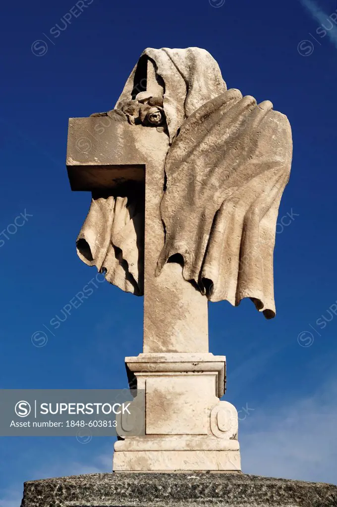 Cloth draped around a stone cross, 19th Century, against a blue sky in the cemetery of Guebwiller, Route de Colmar, Guebwiller, Alsace, France, Europe