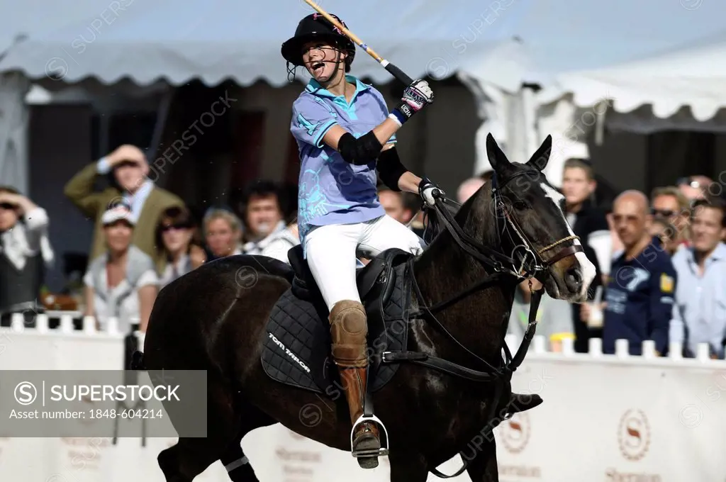 Naomi Schroeder screaming on her polo horse, Tom Tailor polo team, Airport Arena Polo Event 2010, Munich, Upper Bavaria, Bavaria, Germany, Europe