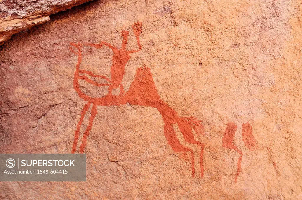 Camel rider, neolithic rockart of the Acacus Mountains or Tadrart Acacus range, Tassili n'Ajjer National Park, Unesco World Heritage Site, Algeria, Sa...