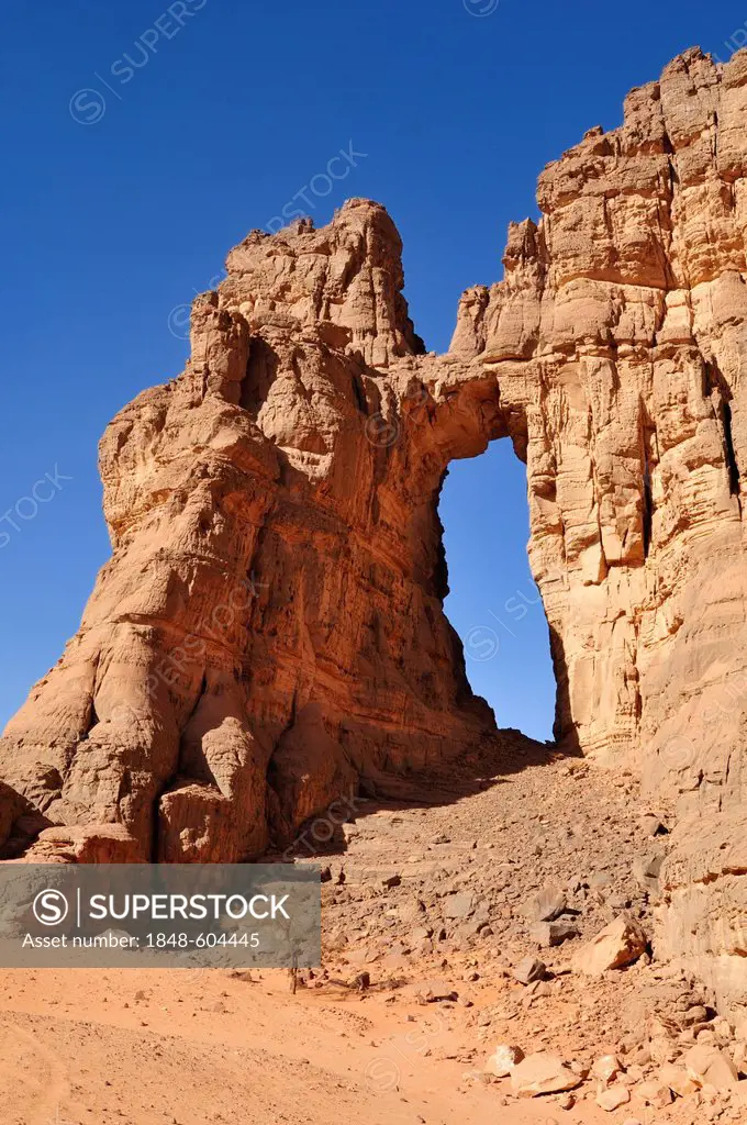 Arch or natural window in the rock formation of La Cathedrale, Acacus Mountains or Tadrart Acacus range, Tassili n'Ajjer National Park, Unesco World H...