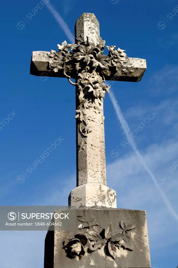 Stone cross, 19th Century, against a blue sky in the cemetery of Guebwiller, Route de Colmar, Guebwiller, Alsace, France, Europe