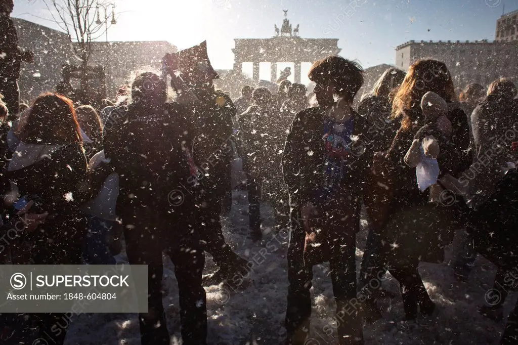 Several hundred people at a flash mob pillow fight arranged through Facebook, at the Brandenburg Gate, Berlin, Germany, Europe