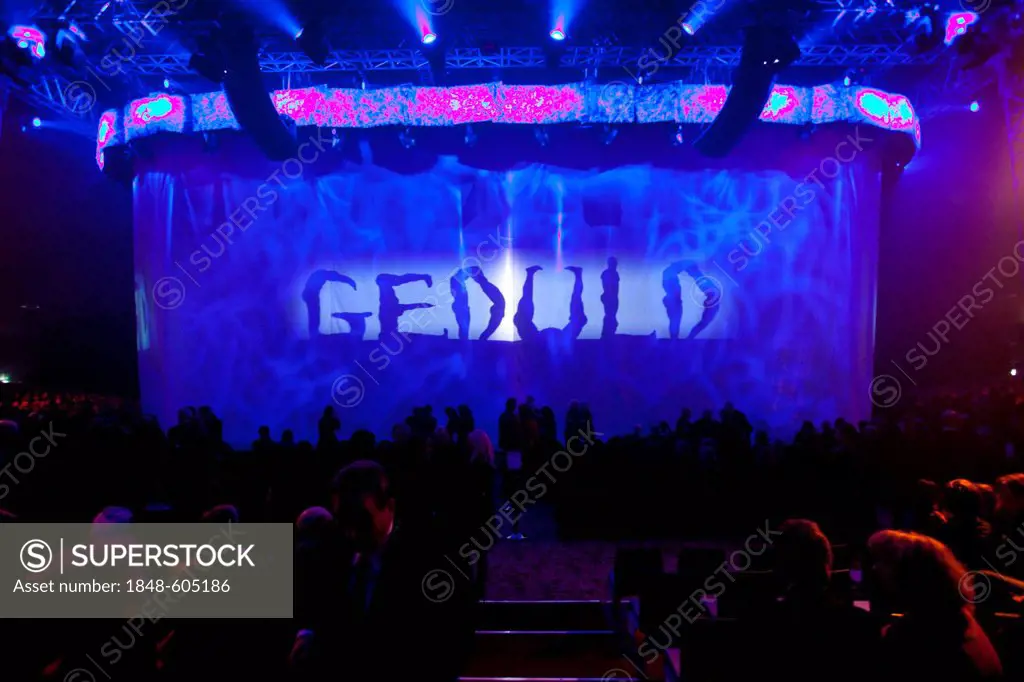 Artists bodies spelling out the word Geduld, German for patience, Magnifico, show by André Heller, world premiere 8 February 2011, Munich, Bavaria, Ge...