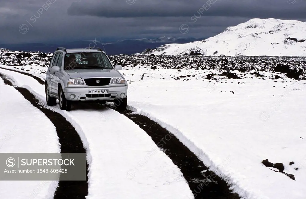 Vehicle travelling in the snowy highlands near Askja, Iceland, Europe