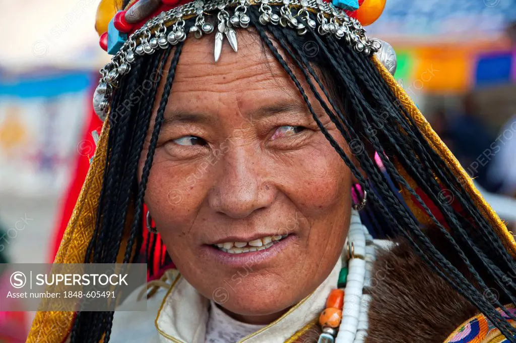 Traditionally dressed woman on the festival of the tribes in Gerze, Western Tibet, Asia