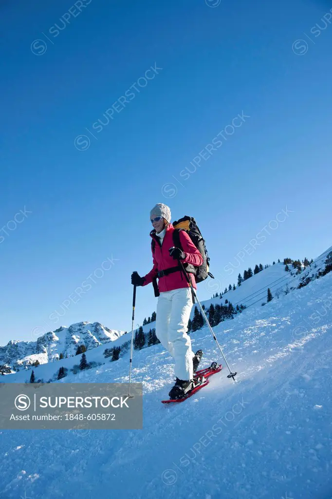 Woman snowshoeing in the mountains