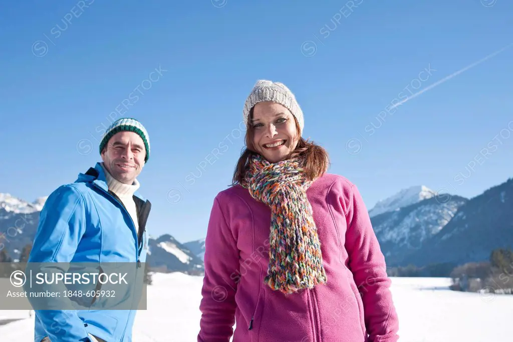 Couple in the snow in the mountains