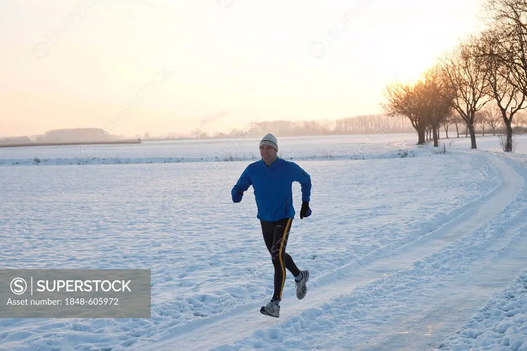 Man jogging in the snow