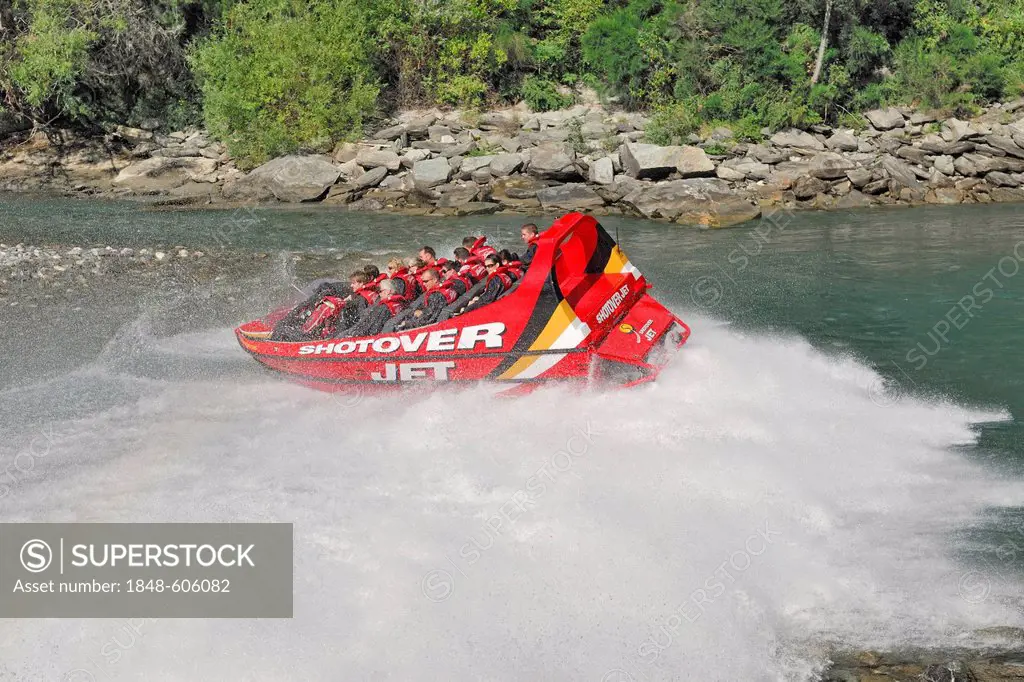 Jetboat, speedboat turning on the Shotover River, Queenstown, South Island, New Zealand