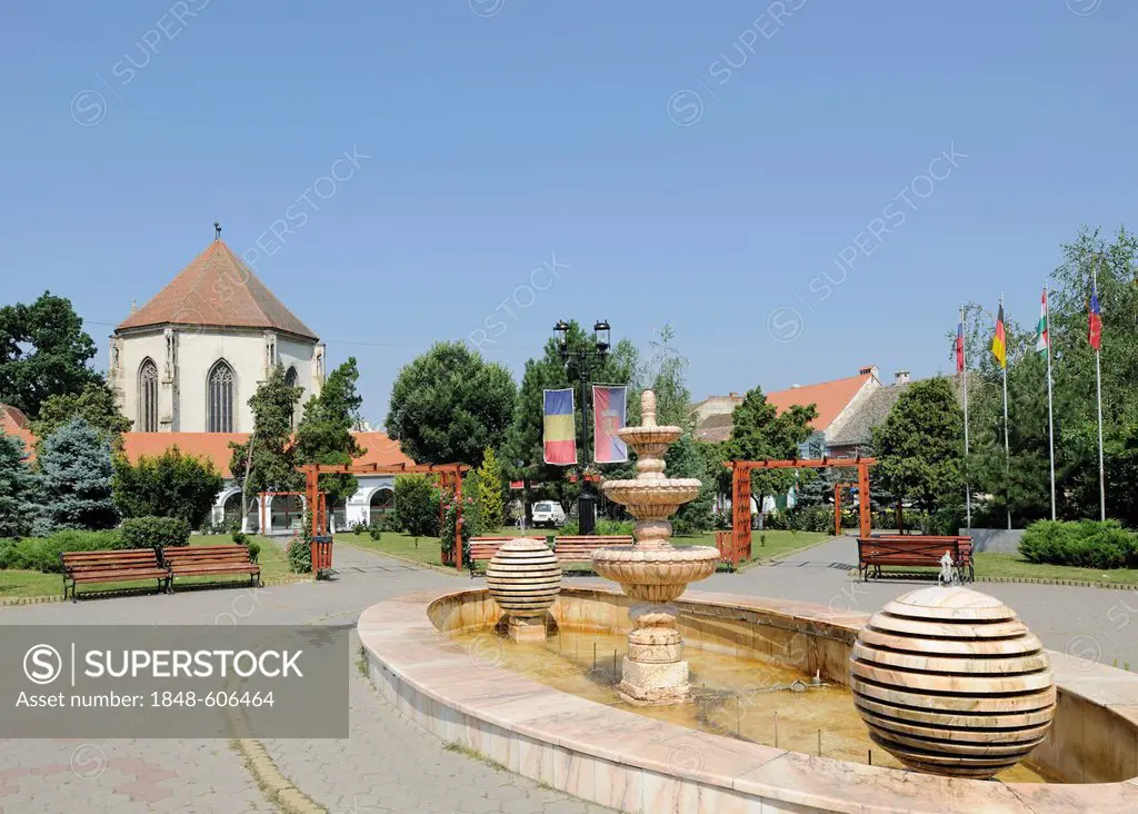 Fountain in the main square and church, Sebes, Muehlbach, Romania, Europe