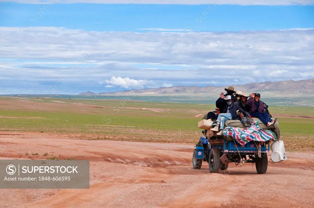 Tibetan pilgrims on a tractor on the road from Gerze to Tsochen, Western Tibet, Tibet, Asia