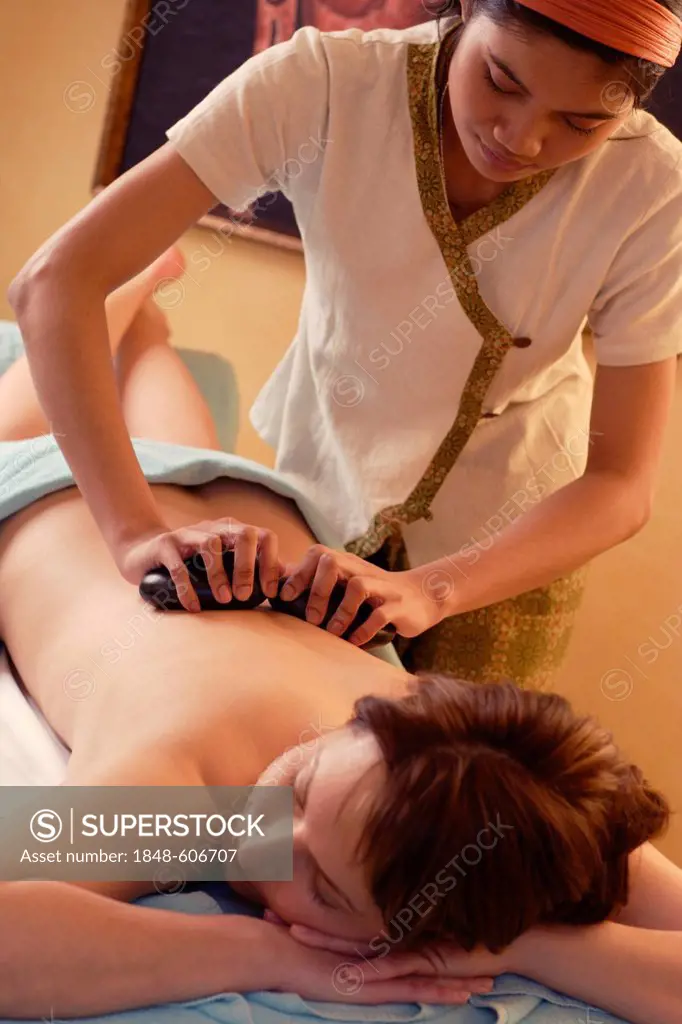 Woman, 35, having a hot stone massage