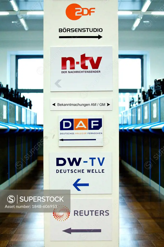Sign with the names of TV stations that report live from the trading floor of the Frankfurt Stock Exchange, Deutsche Boerse AG, Frankfurt am Main, Hes...