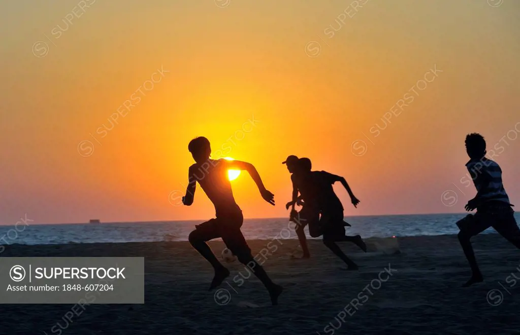 Young men playing football on the beach, Negombo, Sri Lanka, Ceylon, South Asia, Asia