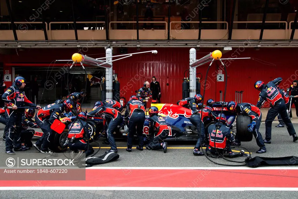 Pit stop of Sebastian Vettel, Germany, in his Red Bull Racing-Renault RB7, Formula 1 testing at the Circuit de Catalunya race track in Barcelona, Spai...