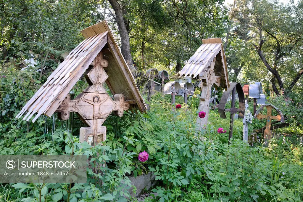 Crosses in the cemetery of the wooden church Biserica Din Deal, Leude Suzani, Iza Valley, Maramures, Romania, Europe