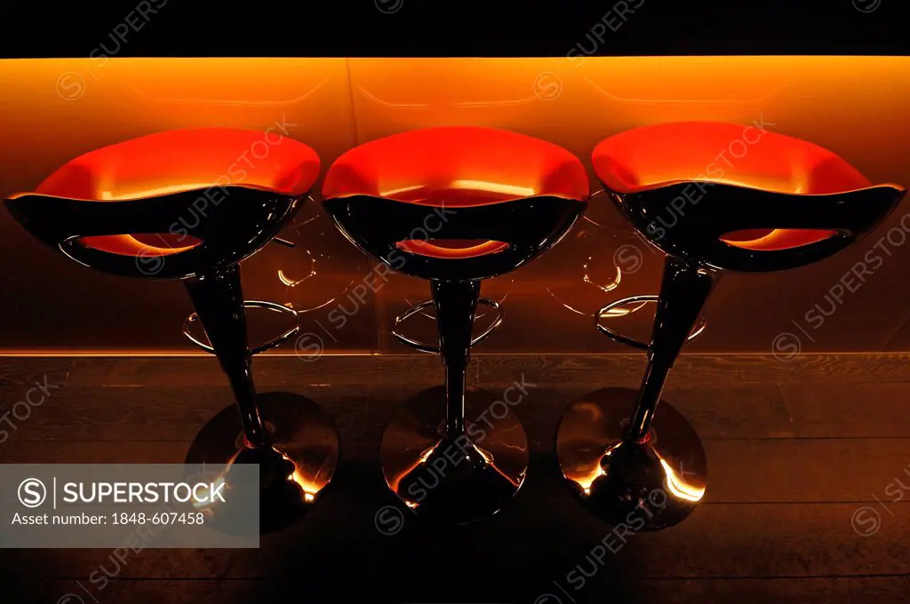 Three red plastic bar stools in front of a bar at a school of hotel management, Lycee Economique et Hôtelier Joseph Storck, Rue du Chemin Noir street,...
