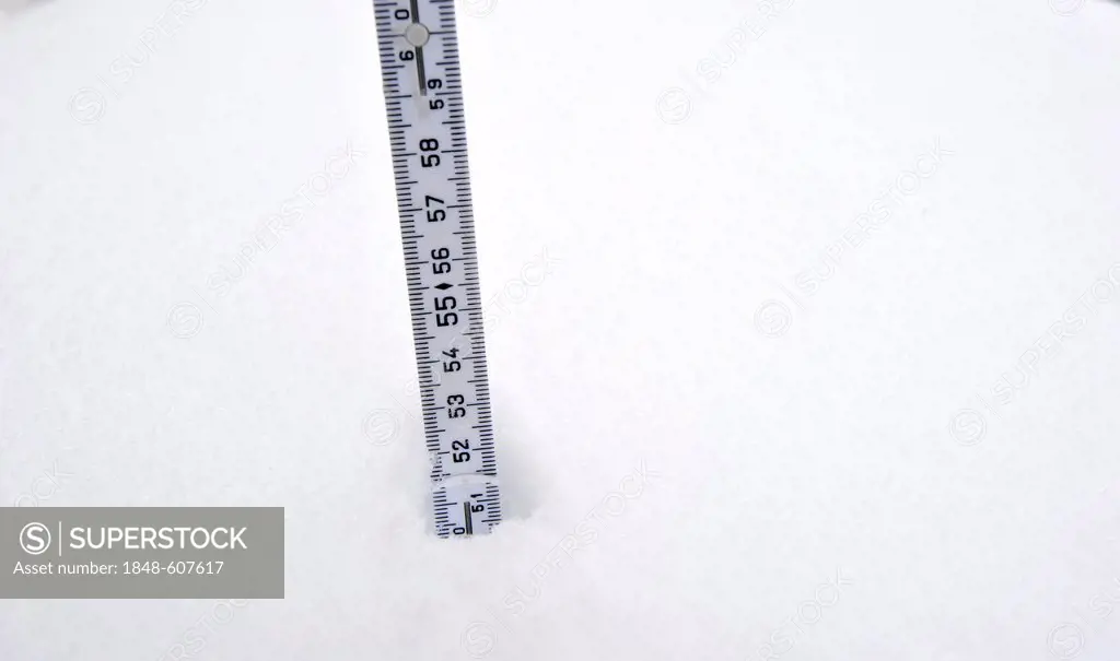 Yard stick in the snow measuring the snow depth