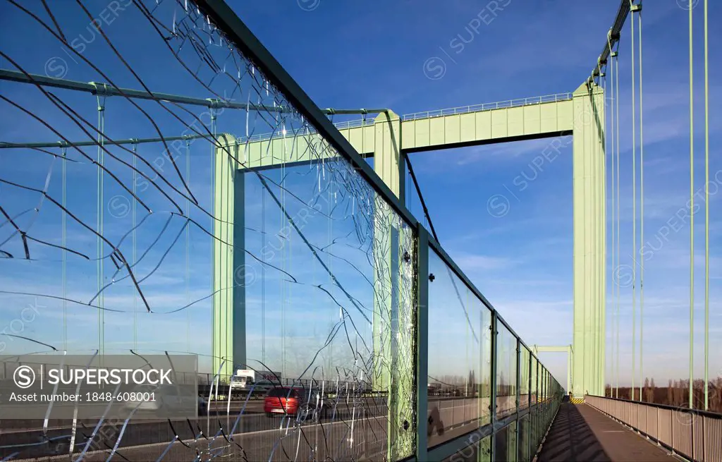 Broken safety glass panel, pedestrian and bicycle path on the Rodenkirchen Rheinbruecke highway bridge over the Rhine, Rodenkirchen, Cologne, North Rh...