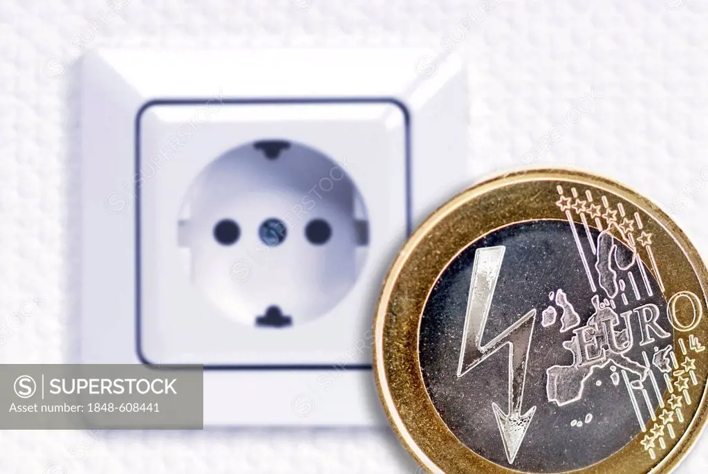 One euro coin with a lightening bolt power symbol in front of a power outlet, symbolic image for rising electricity costs