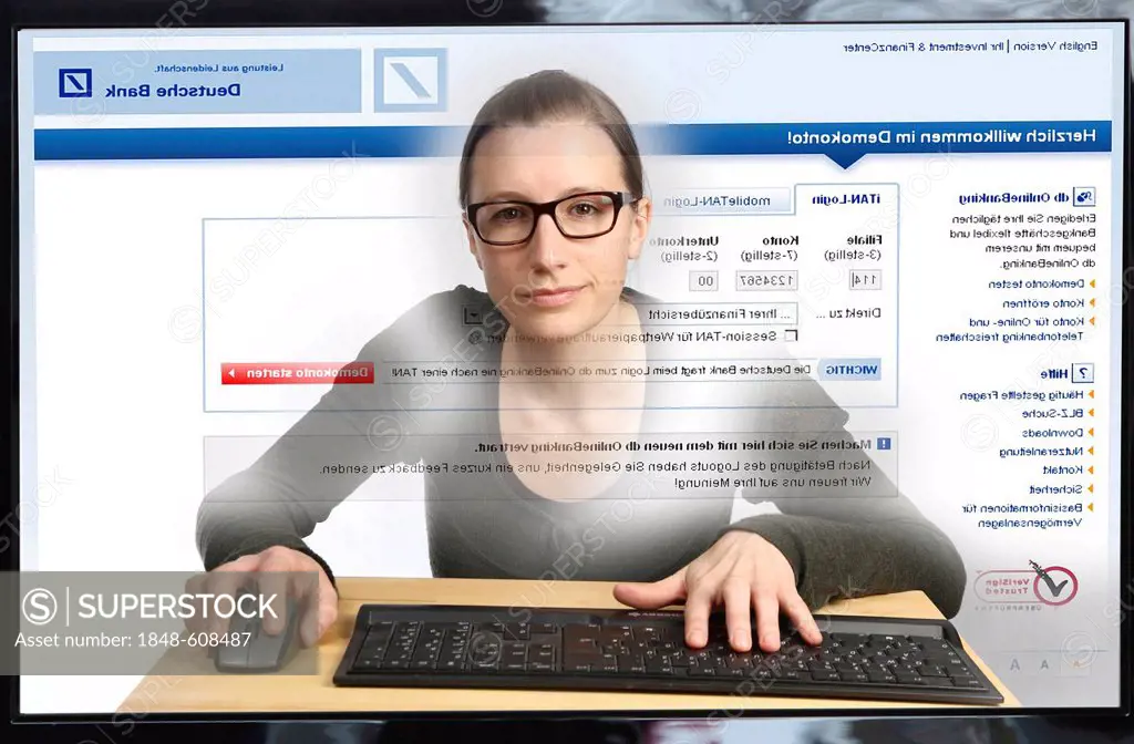 Young woman sitting at a computer surfing the Internet, viewing an Internet banking page, Deutsche Bank, logging into her online account, view from wi...