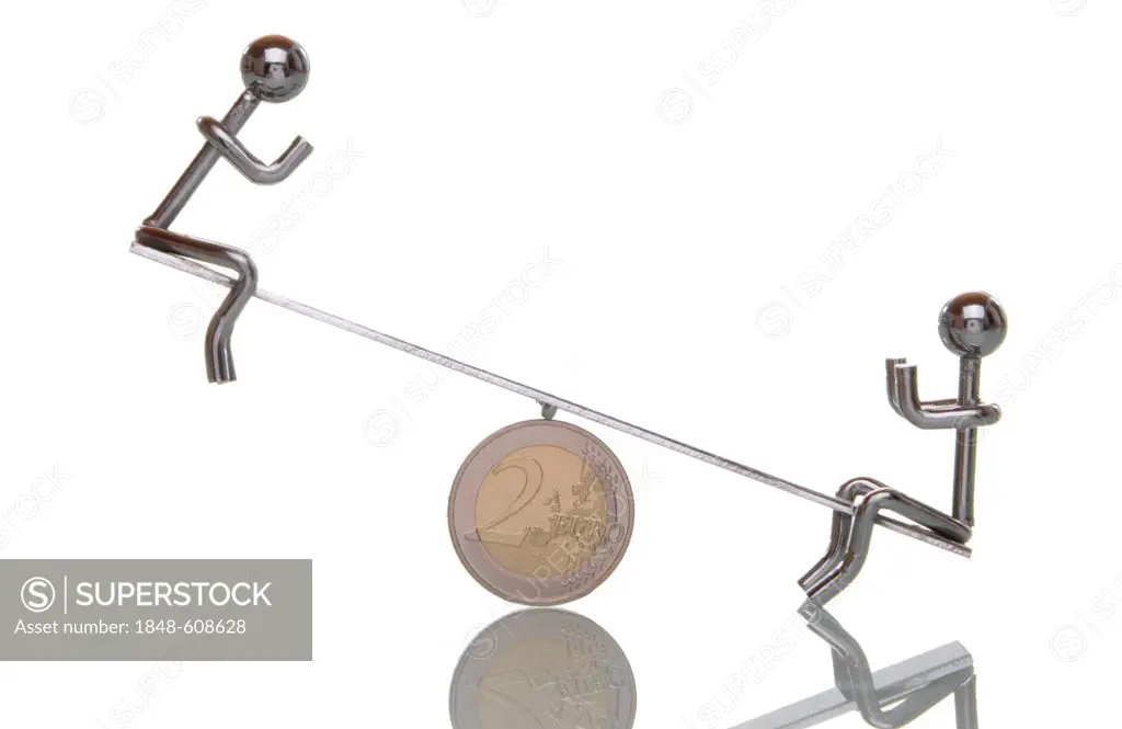See-saw with two figures on a euro coins, symbolic image for imbalances in the euro region