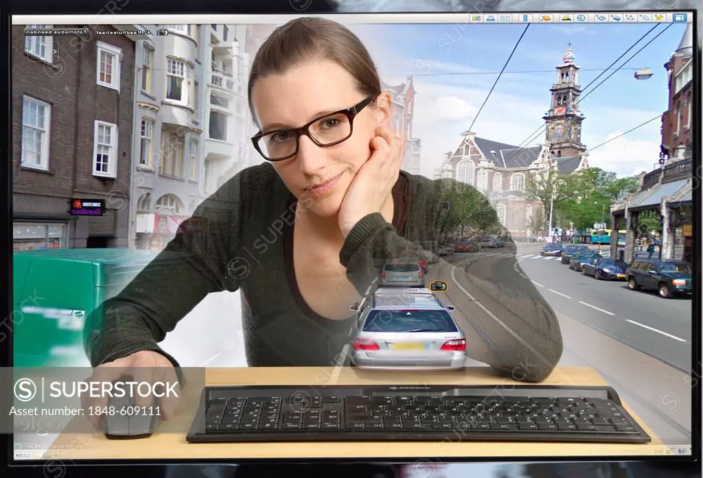 Young woman sitting at a computer using Google Street View, image detail with a section of the city of Amsterdam, people and license plate numbers hav...