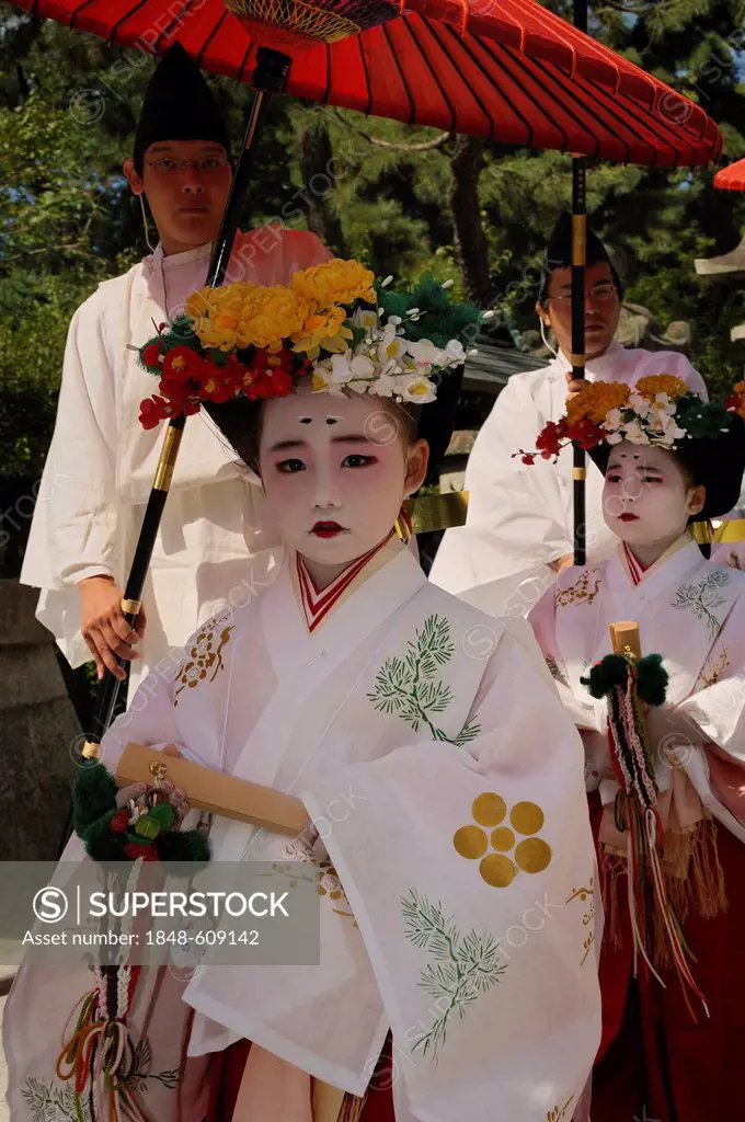 Traditionally dressed and made-up girls at a temple festival, Matsuri Festival, at the Kitano Tenmangu Shrine, Kyoto, Japan, Asia