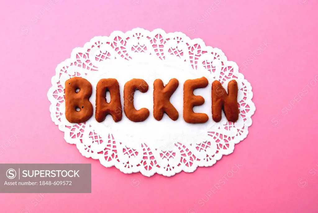 Lettering Backen, German for baking, alphabet biscuits on a cake lace coaster