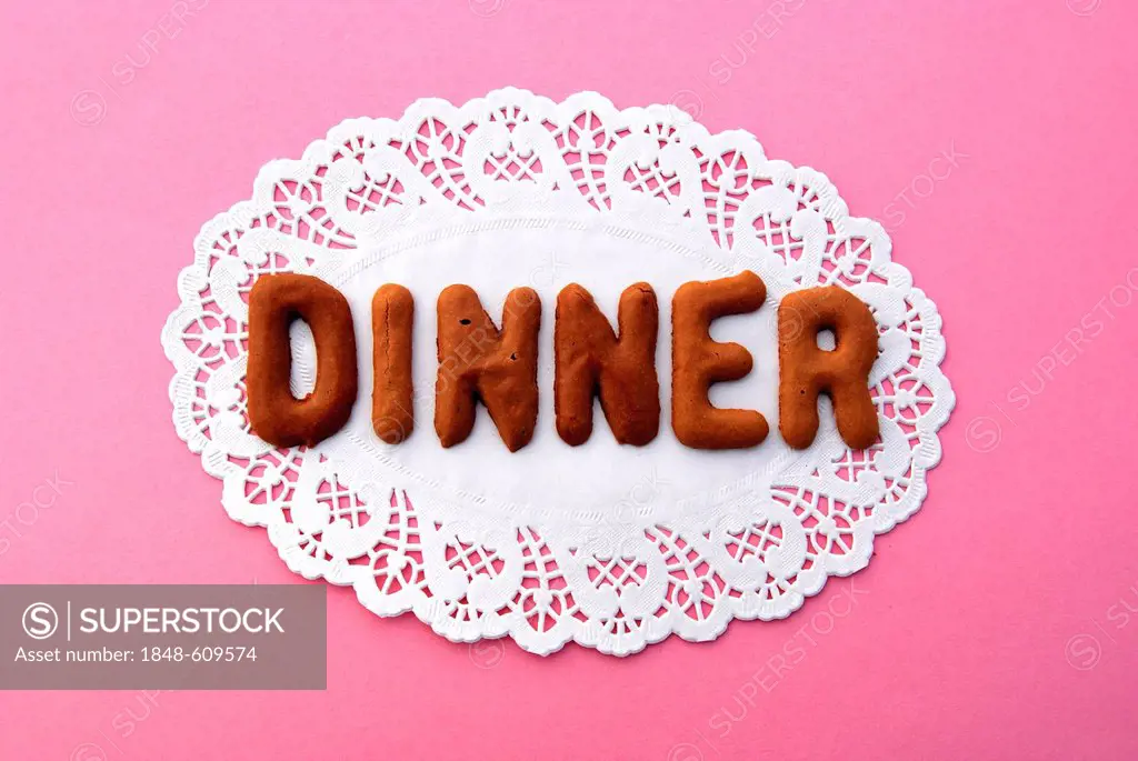 Dinner, lettering, alphabet biscuits on a cake lace coaster
