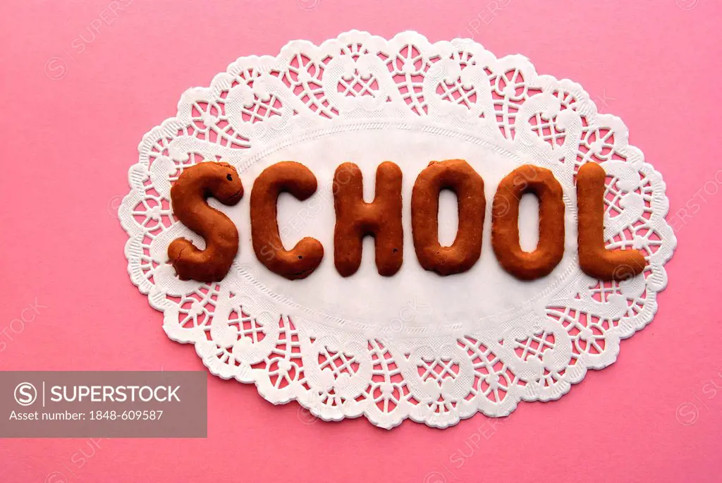 School, lettering, alphabet biscuits on a cake lace coaster