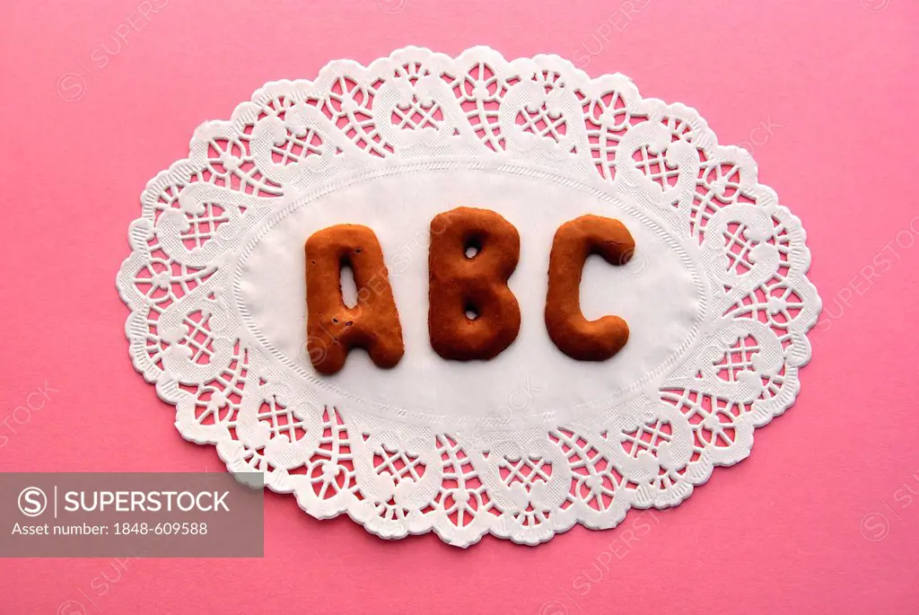 ABC, lettering, alphabet biscuits on a cake lace coaster