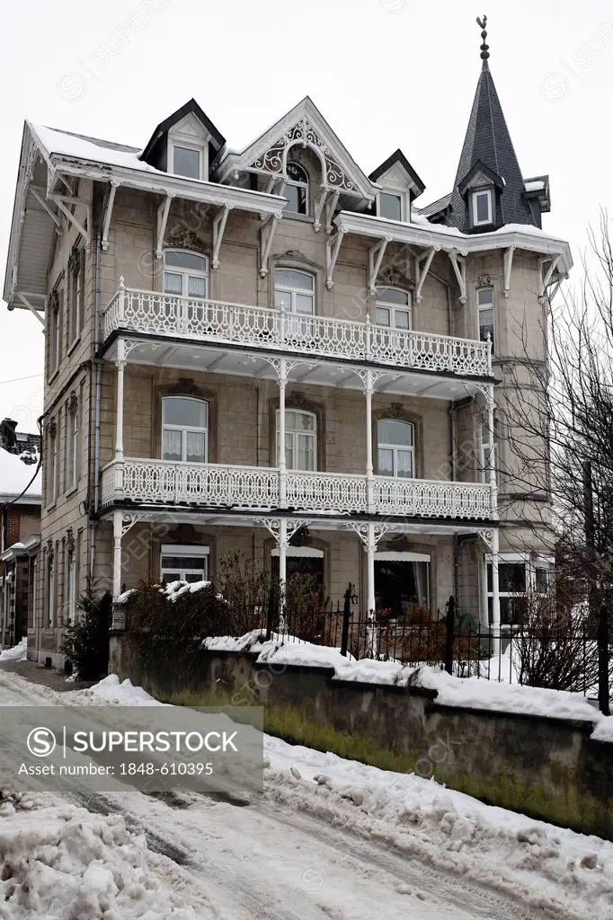 Historic mansion with wooden balconies in an exclusive residential area near the health spa, Ardennes region, Liège province, Wallonia region, Belgium...