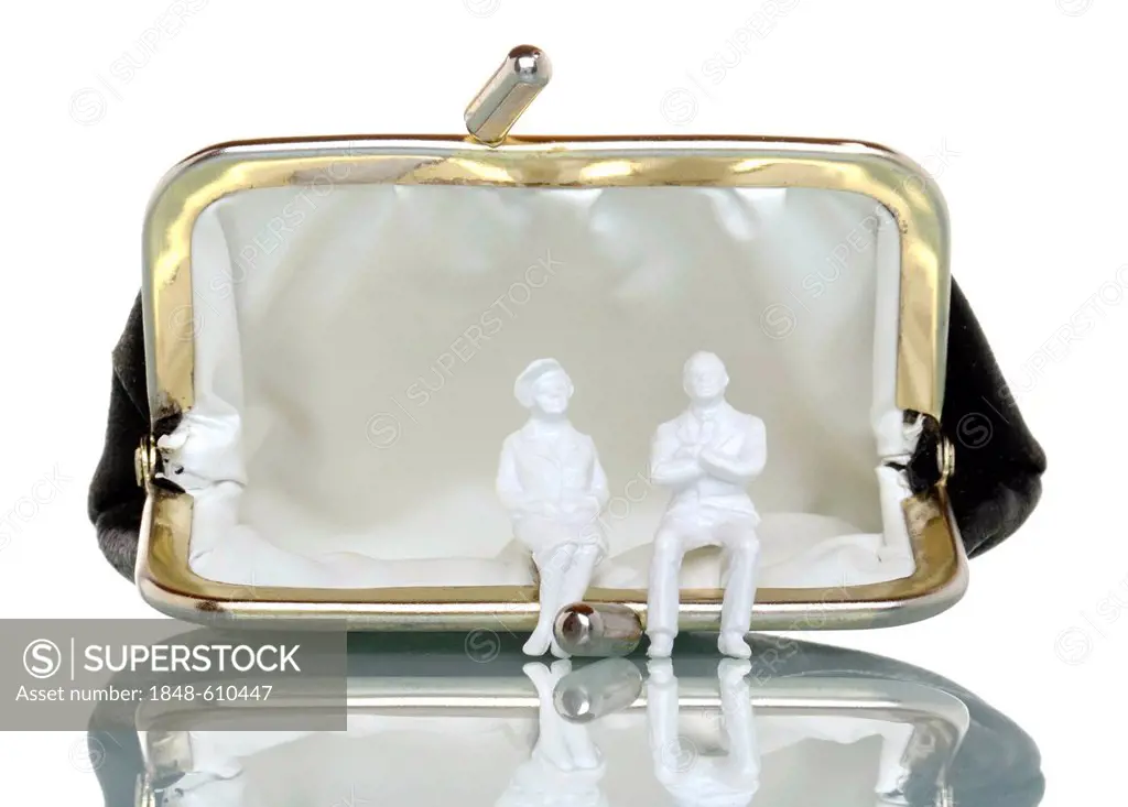 Two figurines of retired people sitting on an empty purse, symbolic image for poverty in old age