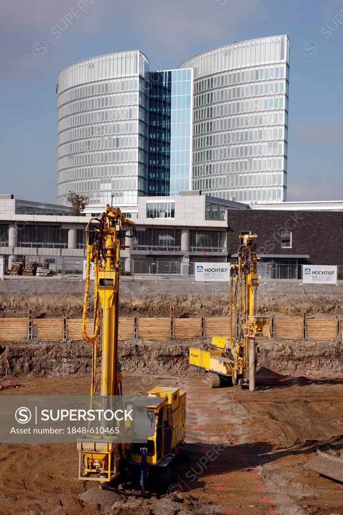 Construction site, machines working on the base with soil consolidation vibrators for an office building in Essen, North Rhine-Westphalia, Germany, Eu...