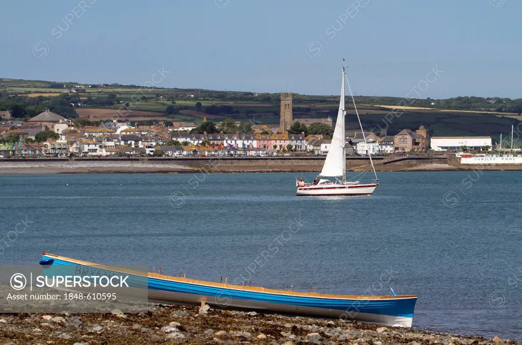 Cornish pilot gig rowing boat on a beach in front of Penzance, Cornwall, England, United Kingdom, Europe
