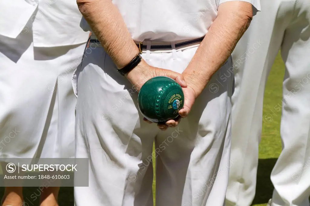 Man holding a bowling ball, Helston Bowling Club, Helston, Cornwall, England, United Kingdom, Europe