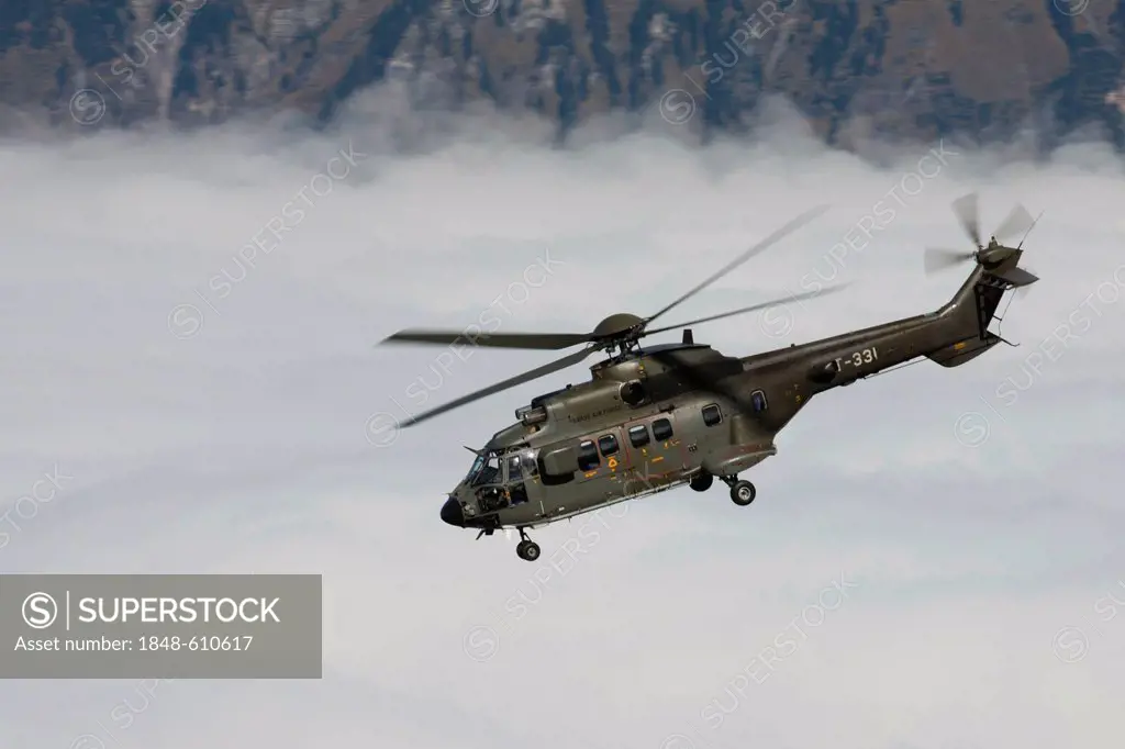 The Swiss military helicopter Cougar above the fog, mountain-air show of the Swiss Air Force at Axalp, Ebenfluh, Interlaken, Bern, Switzerland, Europe