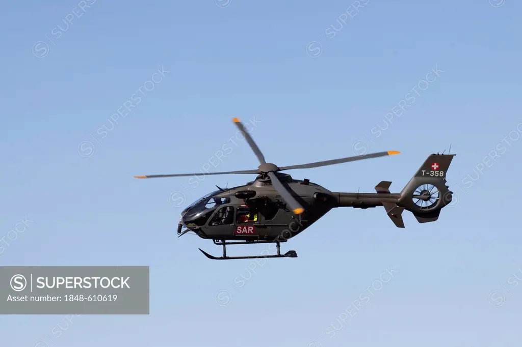The Swiss military helicopter Eurocopter EC635 T-357, mountain-air show of the Swiss Air Force at Axalp, Ebenfluh, Interlaken, Bern, Switzerland, Euro...