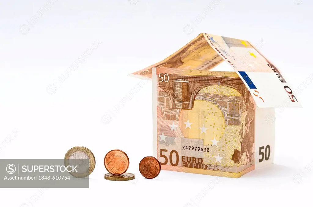 House of banknotes with euro coins