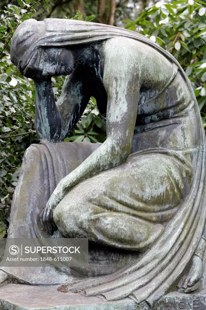 Sculpture of a grieving woman, seated, historic grave sculpture, Nordfriedhof Cemetery, Duesseldorf, North Rhine-Westphalia, Germany, Europe